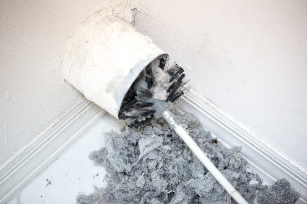 A Rotary Brush Removing Dust From an AC Duct | Dryer Vent Cleaning Service | Envirovac
